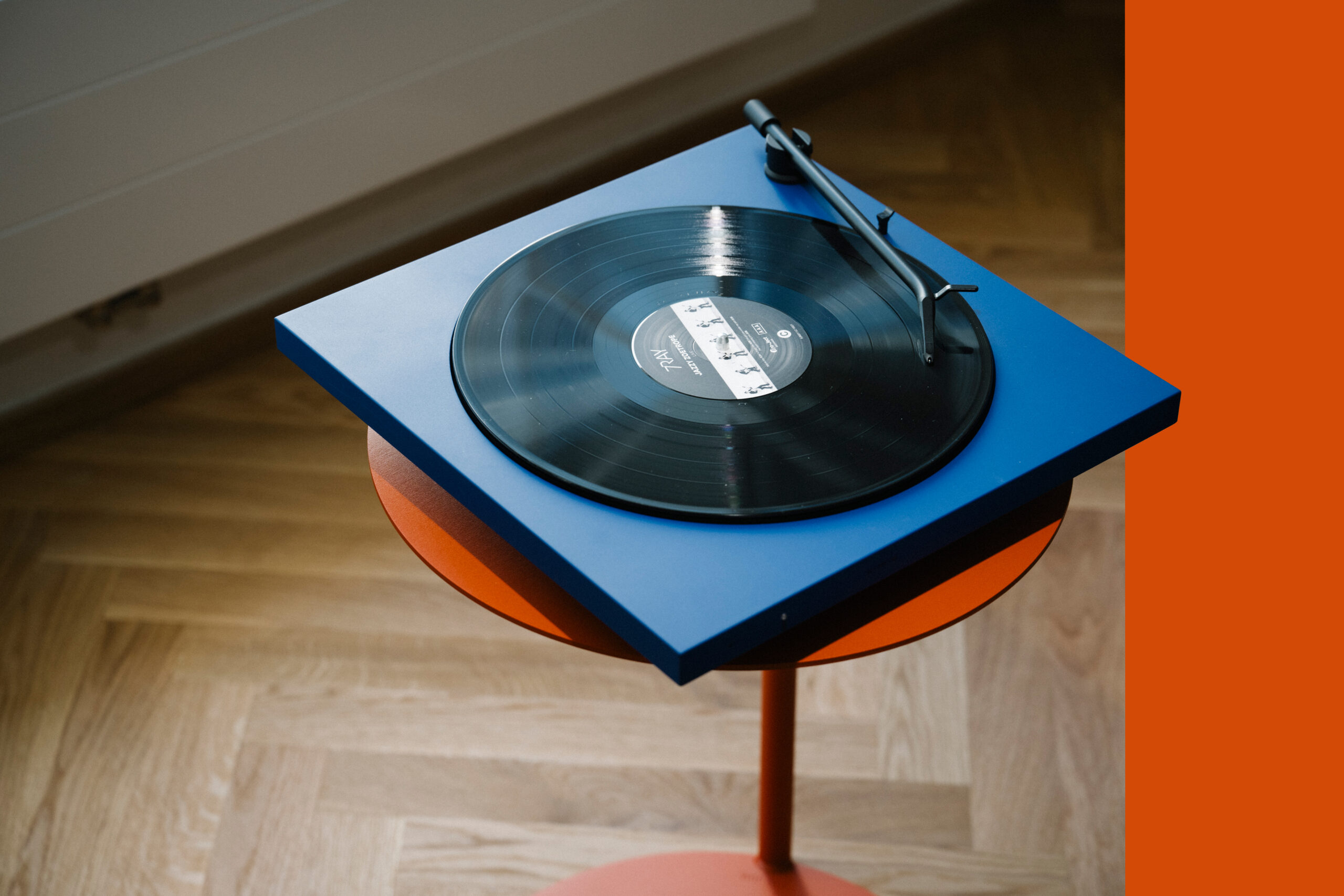 Ultramine blue TONE record player on an orange coffee table